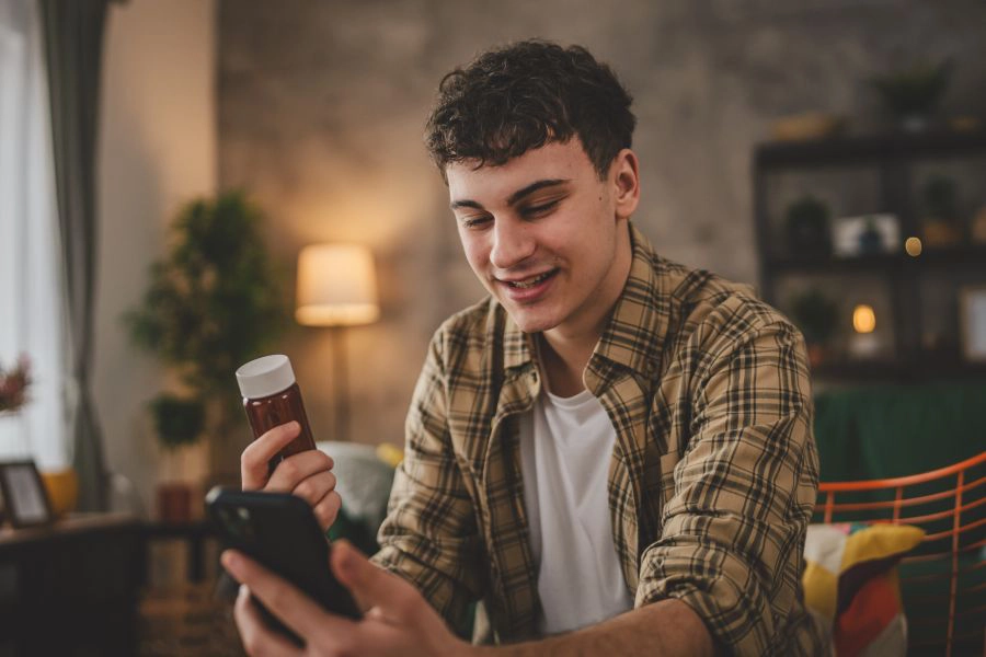 Man checking phone for supplement advice